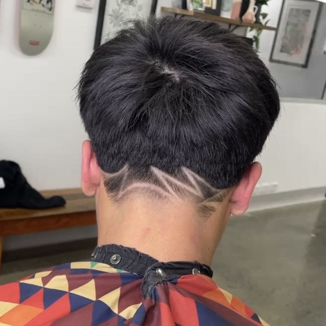 barber shaved in patterns black wolf collective erina