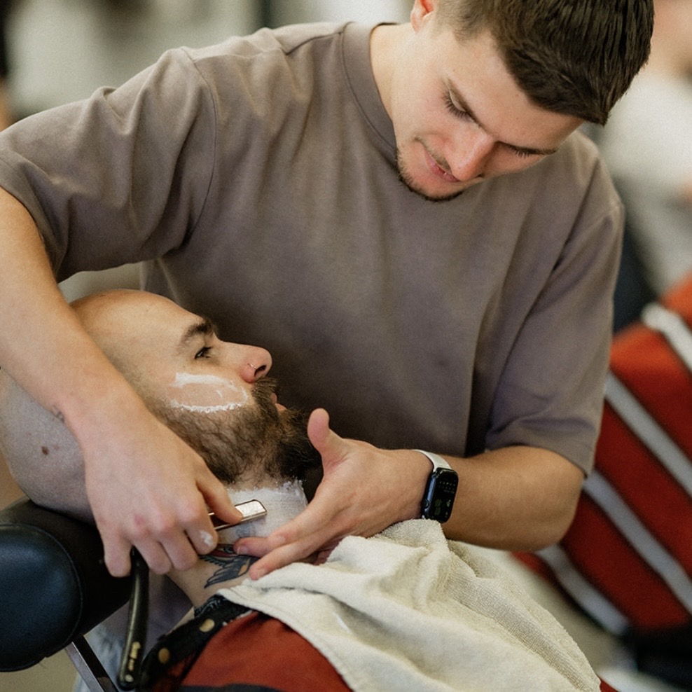 Traditional premium barber hot towel face shave with cut throat razor black wolf barbers erina